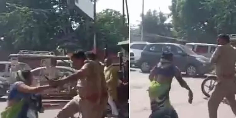 പട്ടാപ്പകൽ നടുറോഡിൽ പൊലീസുദ്യോഗസ്ഥനും സ്ത്രീയും തമ്മിൽ അടി; പിന്നാലെ സസ്പെൻഷൻ