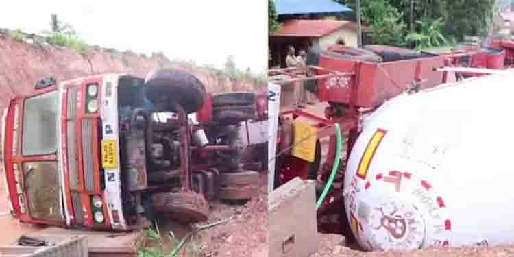 റോഡ് പണിയിൽ വഴി തെറ്റി, മഴയിൽ ടയർ മണ്ണിലേക്ക് താഴ്ന്നു; തിരുവനന്തപുരത്ത് ഗ്യാസ് ടാങ്കർ ലോറി മറിഞ്ഞ് അപകടം